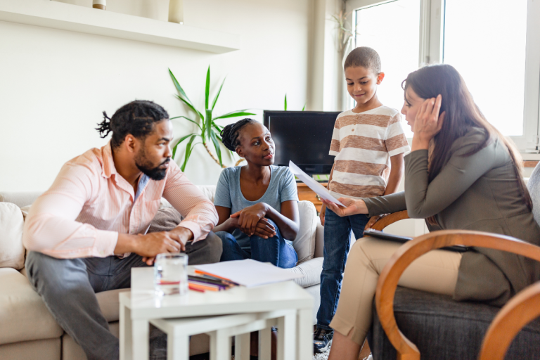 behavioral-health-specialist-communicating-with-parents-in-care-setting