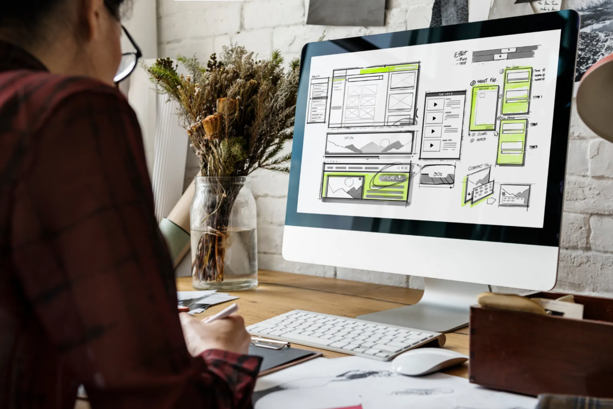 person-looking-at-computer-working-on-sitemap-for-web-redesign