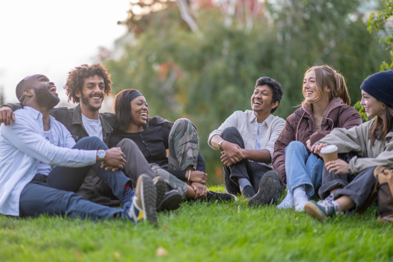 group-of-college-students-sitting-on-a-hill